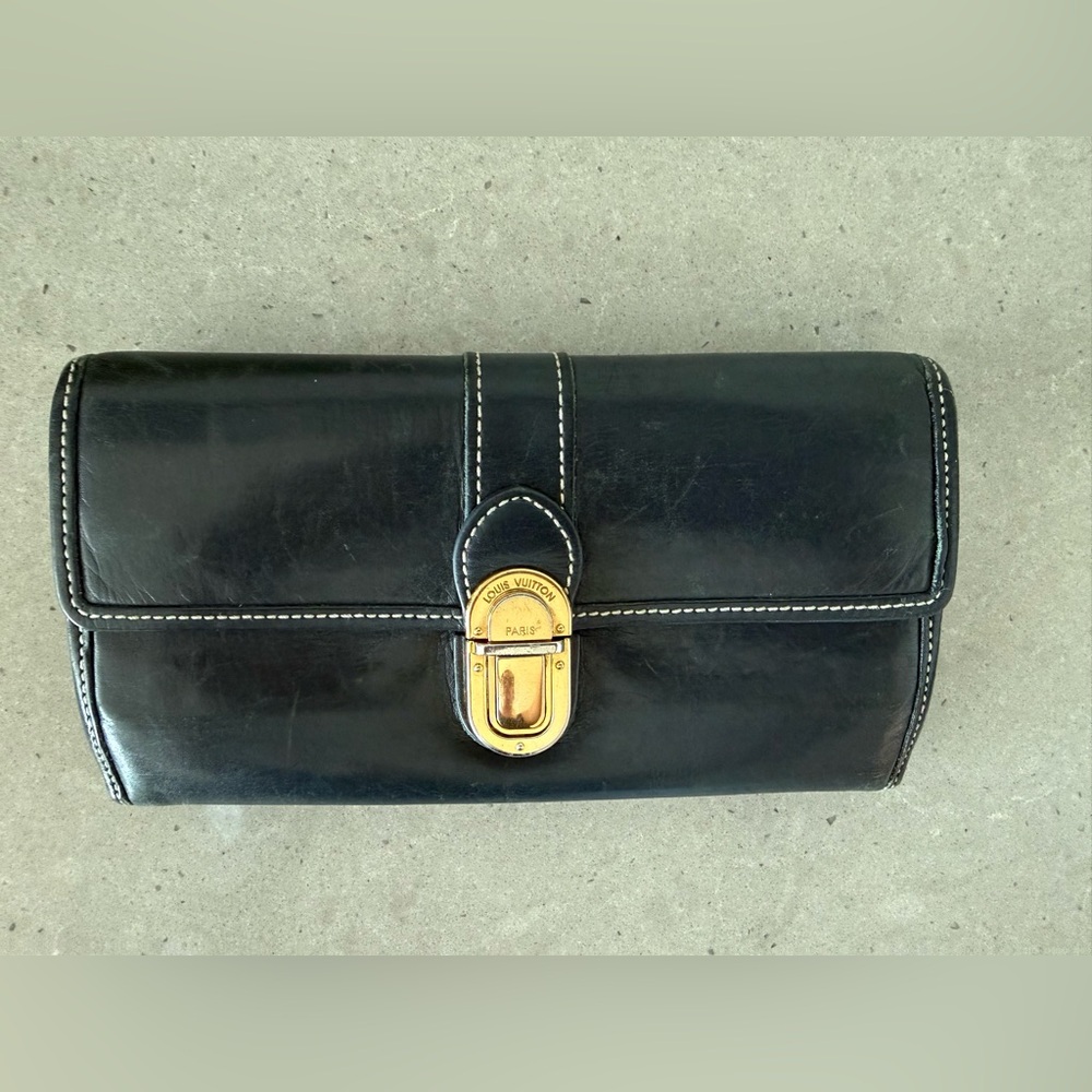 Authentic Louis Vuitton Black Leather Clutch wallet with Gold Accent